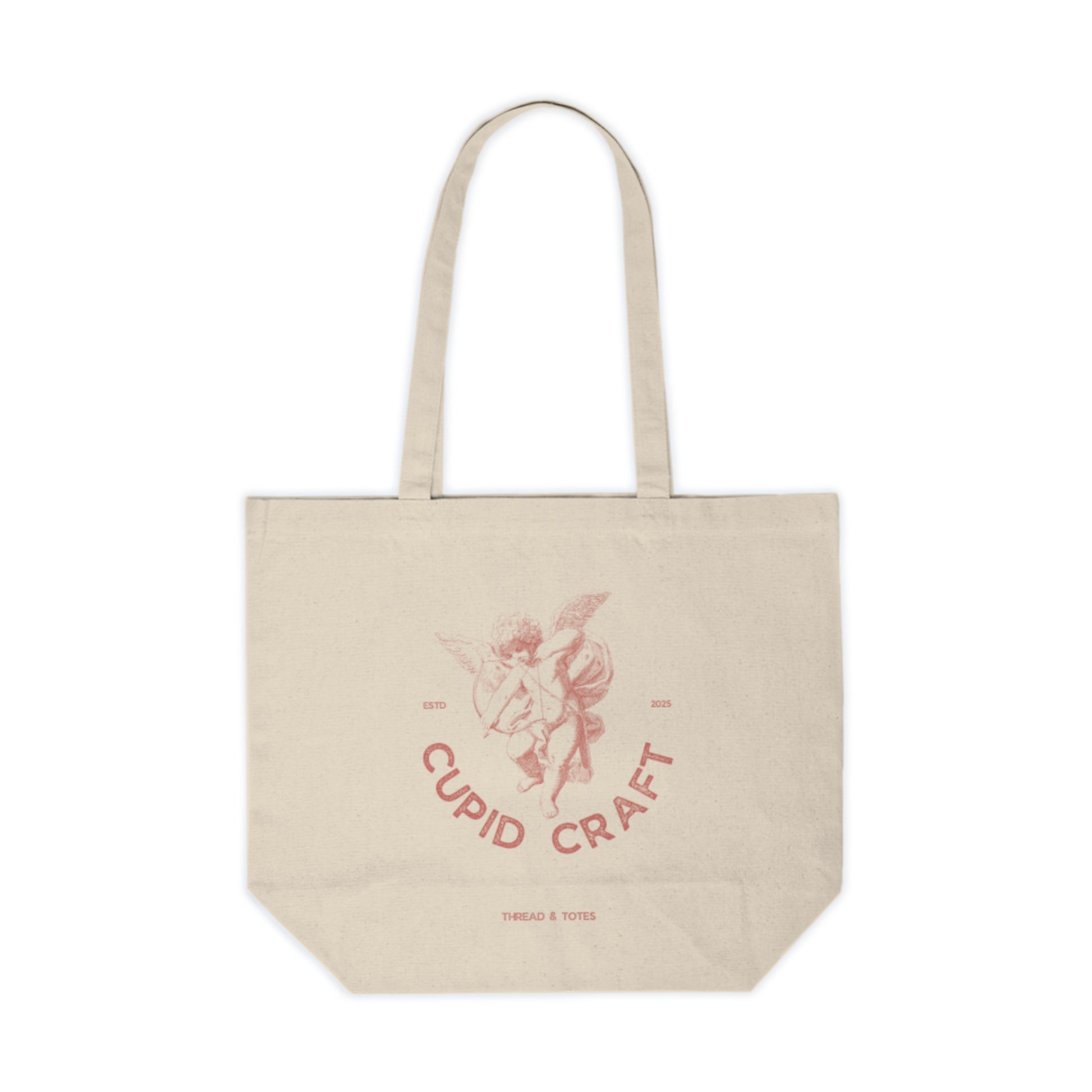 Beige tote bag with 'Cupid Craft' design on a white background